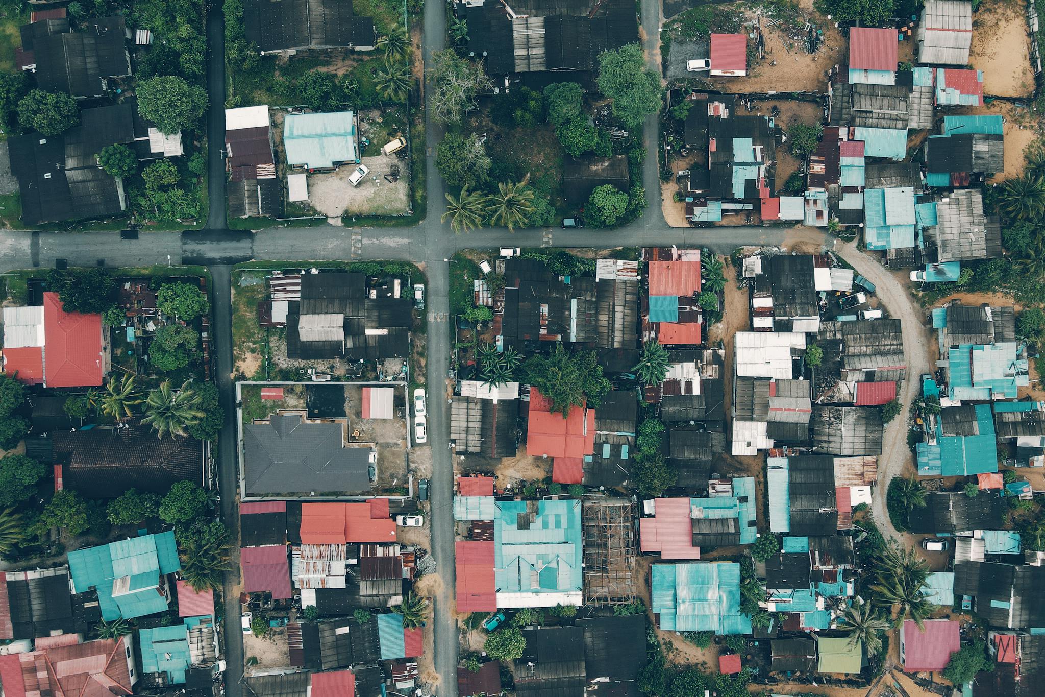 Aerial perspective of traditional residential homes and streets in Chukai, Malaysia.