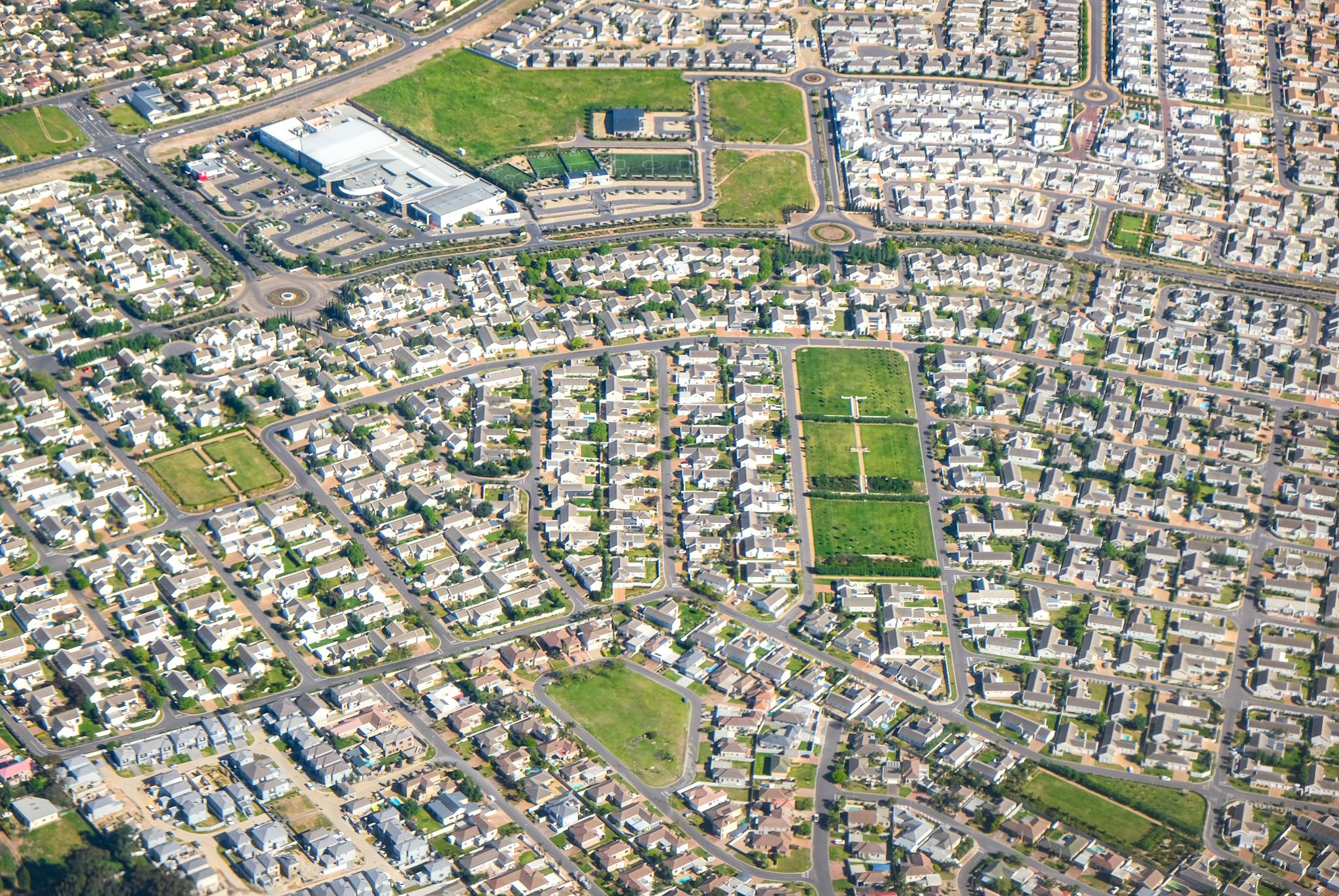 Discover this expansive suburban neighborhood from above, showcasing modern residential planning.